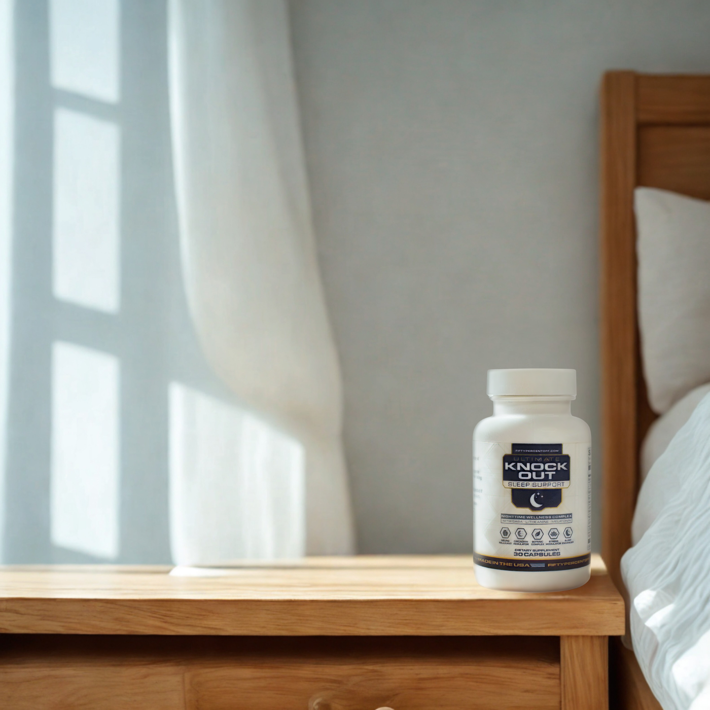 Supplement bottle labeled 'Knock Out' on a wooden nightstand with a bed and curtains in the background.