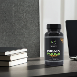 Bottle of Brain Force Plus supplement on a desk with books and a laptop in the background